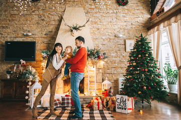 Young family in Christmas interior