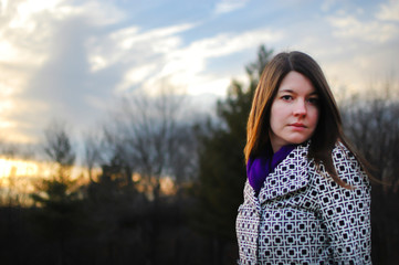 Caucasian female model poses for pictures in the nature