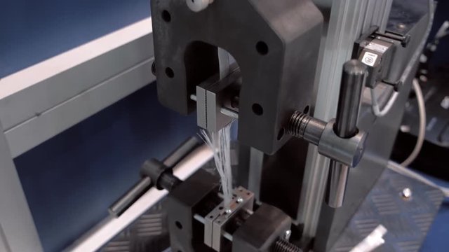 Industrial equipment for testing carbon fiber for break. Shot in motion
