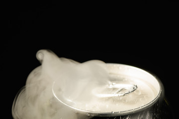 aluminum soda can neck with ring large with smoke coming out of the hole copyspace