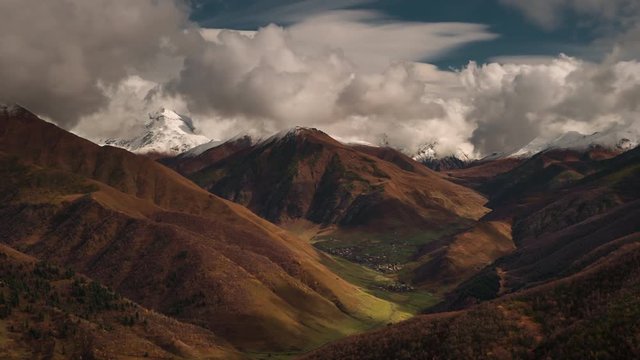 timelapse cloud in the mountains valley and village