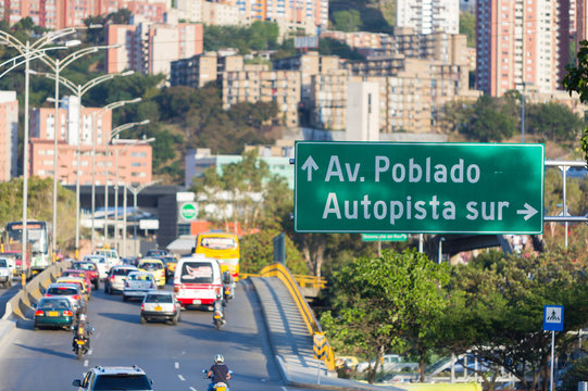 Cityscape and traffic sign road to Poblado, Medellin
