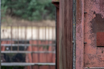 old red metal bridge over water