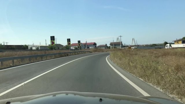Driving on a road in Romania, on the Black Sea coast.