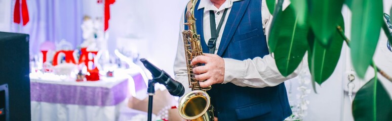  performance of a saxophonist musician at the New Year's holiday, wedding.