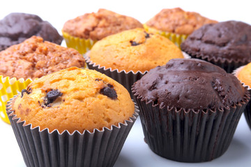 Assorted with Delicious homemade cupcakes with raisins and chocolate isolated on white background. Muffins. Top view.