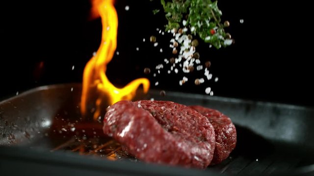 Super slow motion of beef steak in flames. Filmed on high speed cinema camera, 1000 fps.