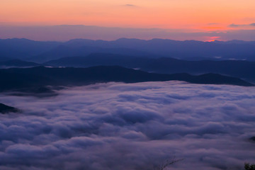  sunset overlooking mountains with Mist