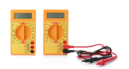 Set with digital multimeters on white background. Electrician's tool