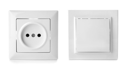 Light switch and power socket on white background. Electrician service