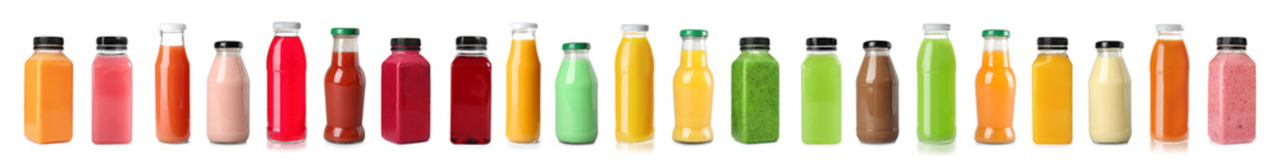 Set with bottles of different juices on white background