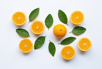 Oranges and green leaves on white background.
