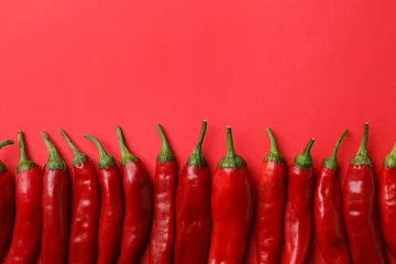 Fotobehang Flat lay composition with fresh chili peppers and space for text on color background © New Africa