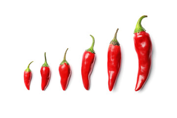 Fresh red chili peppers on white background, top view