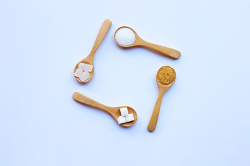 Various types of sugar on white background.