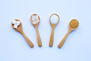 Various types of sugar on white background.