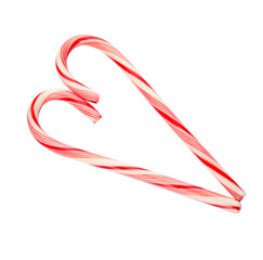 Heart shape made of tasty candy canes on white background. Festive treat