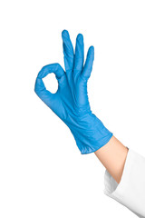 Doctor in medical glove showing OK gesture on white background