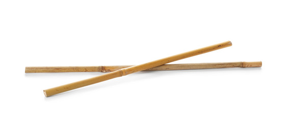 Obraz premium Dry bamboo sticks on white background. Organic material