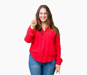 Beautiful plus size young business woman over isolated background showing and pointing up with finger number one while smiling confident and happy.