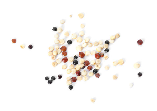 Mixed quinoa seeds on white background, top view
