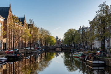 Fototapeta na wymiar Canals of Amsterdam at morning. Amsterdam is the capital and most populous city of the Netherlands.