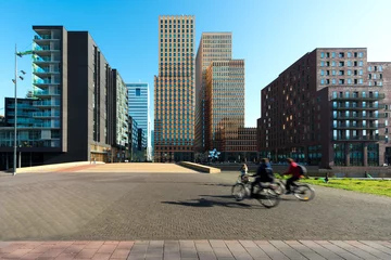 Foto op Aluminium Office buildings in Amsterdam Zuid, Amsterdam, Netherlands. People bicycling in Amsterdam, Netherlands. © ake1150