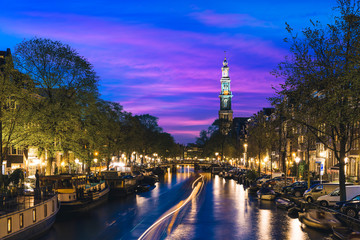 Canals of Amsterdam at night in Netherlands. Amsterdam is the capital and most populous city of the...