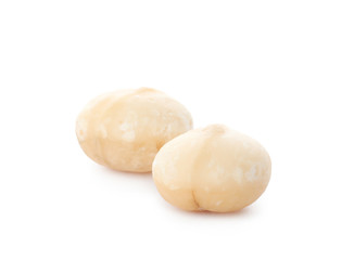 Fototapeta na wymiar Shelled organic Macadamia nuts on white background