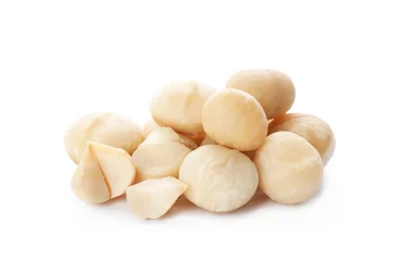 Poster Shelled organic Macadamia nuts on white background © New Africa