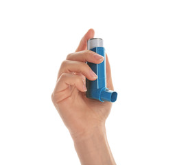 Woman holding asthma inhaler on white background, closeup
