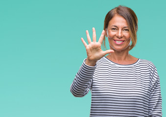 Middle age senior hispanic woman over isolated background showing and pointing up with fingers...