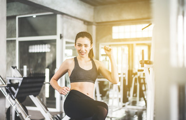 Fototapeta premium Happy sport asian woman stretching for warming up before doing exercises training,Cross fit body muscular workout