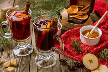 Mulled wine on old wooden background