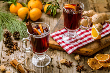 Mulled wine on old wooden background