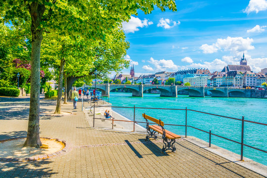 Basler m&uuml;nster and Saint martin church viewed behind the mittlere br&uuml;cke in Basel, Switzerland