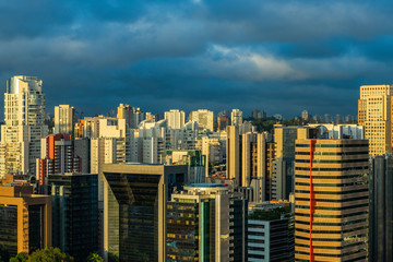 Beautiful sunset between the buildings of the big city. Sao Paulo city Brazil South America. 