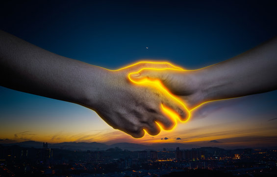 Abstract light effect image of business handshake , business cooperation success  concept .