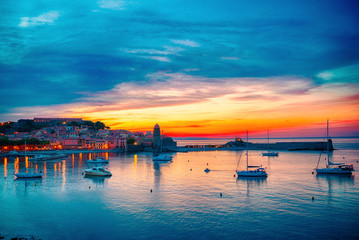 Fototapeta na wymiar Beautiful dramatic sunset sky over small bay of Collioure, France.
