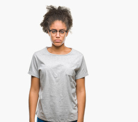 Fototapeta na wymiar Young afro american woman wearing glasses over isolated background depressed and worry for distress, crying angry and afraid. Sad expression.