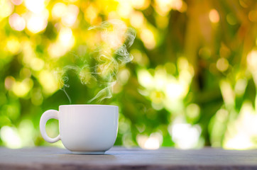 Cup of coffee on table in cafe ,Morning time ,morning light.