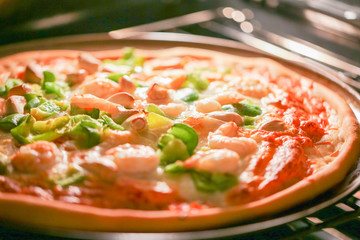 Pizza with seafood close up.