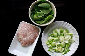 Crushed pork in foam box ready to cook, Lettuce.