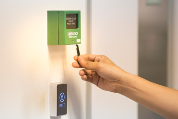 insert the key on emergency door release to open the door during power outage. safety concept (Soft...