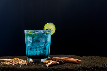 Blue cocktail on old wooden