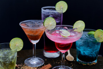 selection drinks and cocktails set on old wooden background