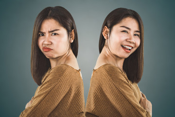 bipolar disorder personality. Asian woman face happy and depressed moods  