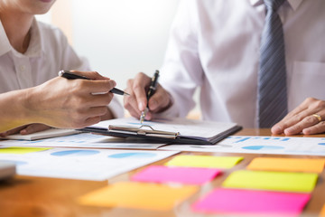 Business team data analyzing income charts document during discussion explain strategy meeting. on...