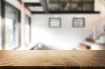 Wooden board empty Table Top And Blur Interior over blur in coffee shop Background, Mock up for display of product