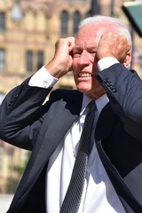 Stressed Adult Senior Business Man Wearing Suit And Tie